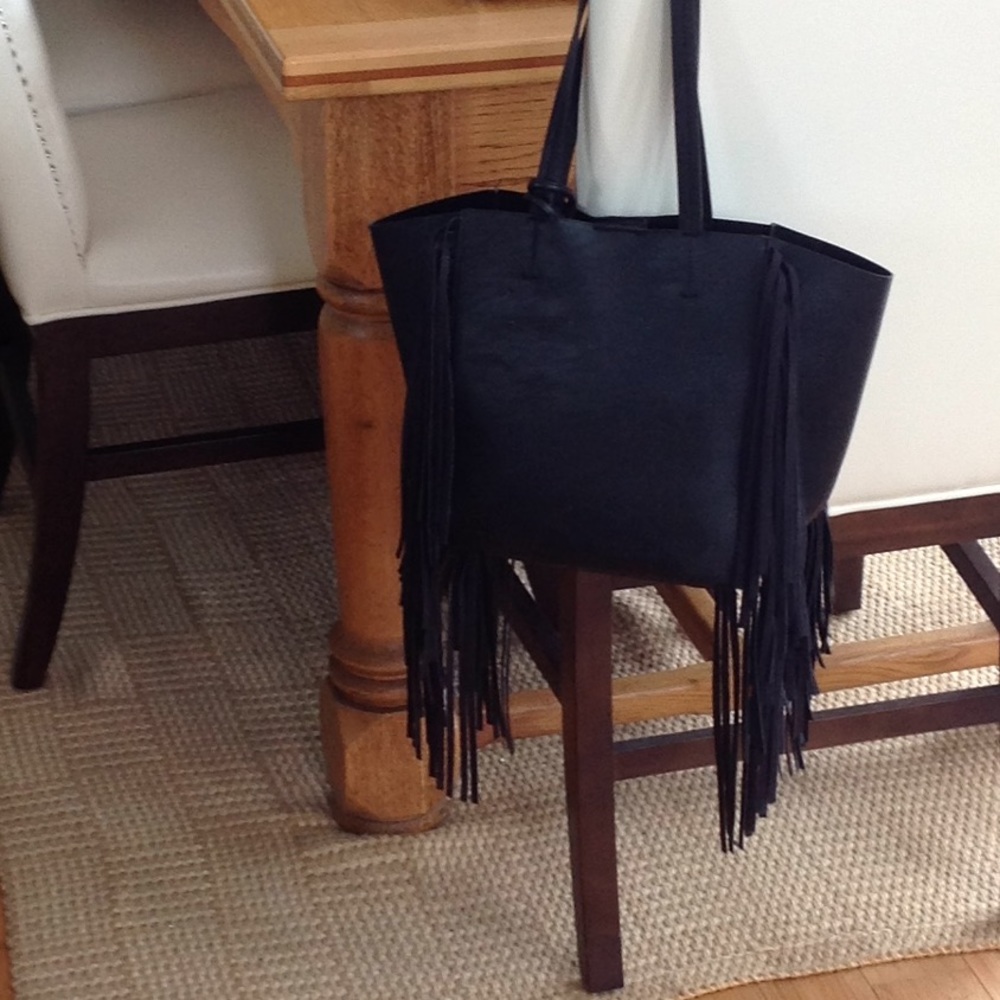 Black shoulder bag with fringe